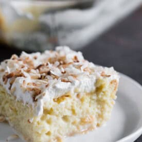 You're going to go crazy over this toasted coconut tres leches cake. To jazz it up I used creamy coconut milk, coconut rum, spiced rum AND toasted coconut. This is the tres leches cake of your dreams!