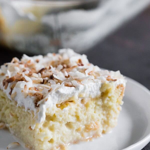You're going to go crazy over this toasted coconut tres leches cake. To jazz it up I used creamy coconut milk, coconut rum, spiced rum AND toasted coconut. This is the tres leches cake of your dreams!