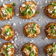 These pesto hummus sweet potato bites are the perfect bite size appetizer. Sumac roasted sweet potato rounds topped with spicy hummus, drizzled with spinach pesto and sprinkled with crumbled feta - how delicious is that!