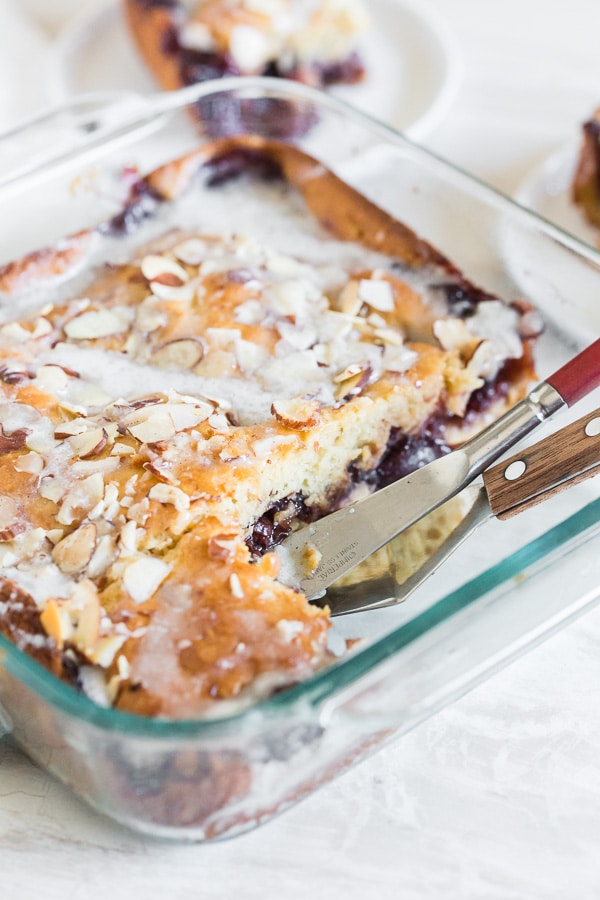 Cherry Fritter Cake sliced in a 9x9 glass dish. 