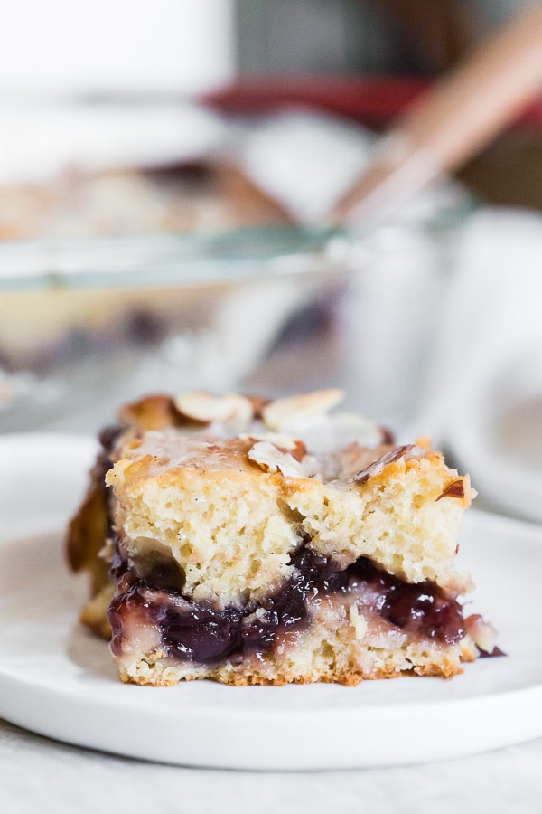 Cherry Fritter Cake sliced to show the inside cherry layer. 