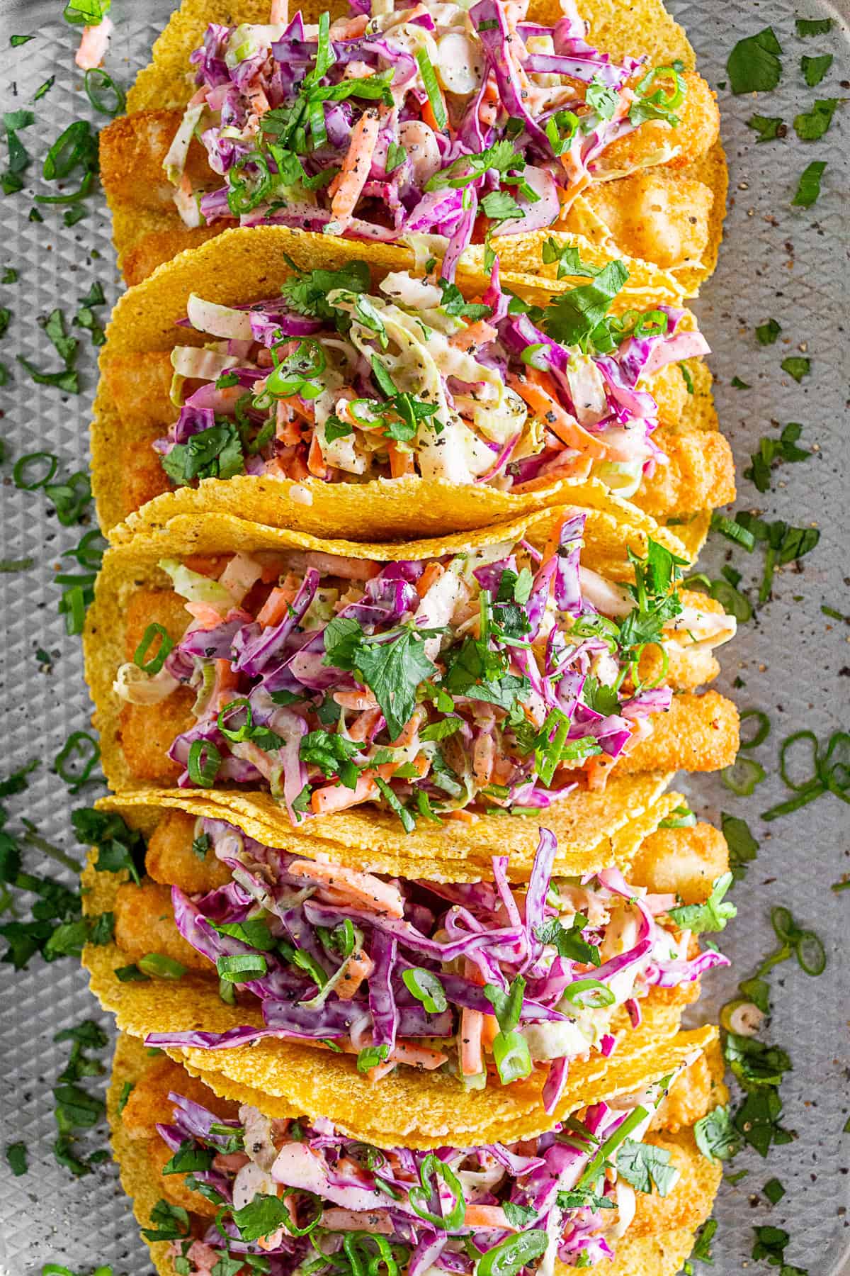 Fish stick tacos topped with slaw.