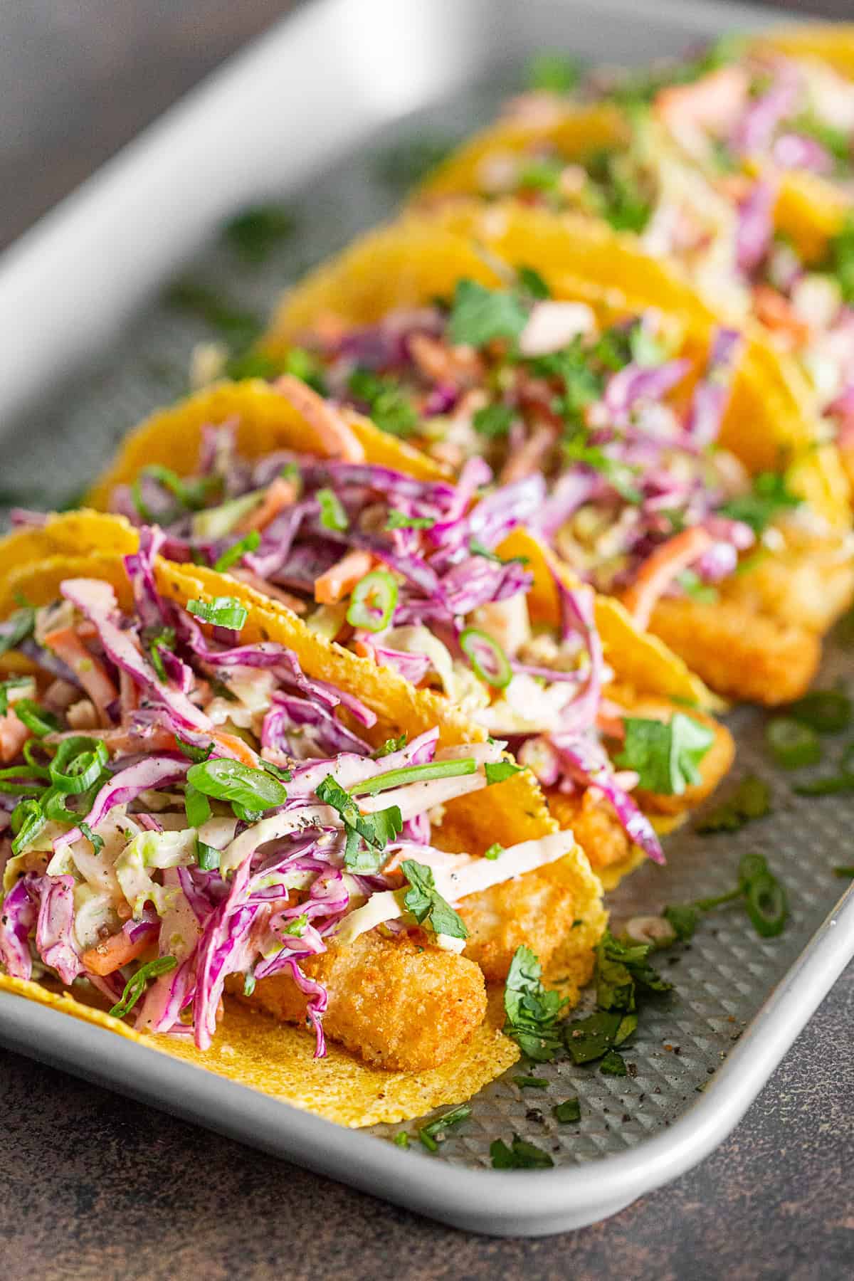 Easy Fish Tacos topped with greek yogurt slaw.