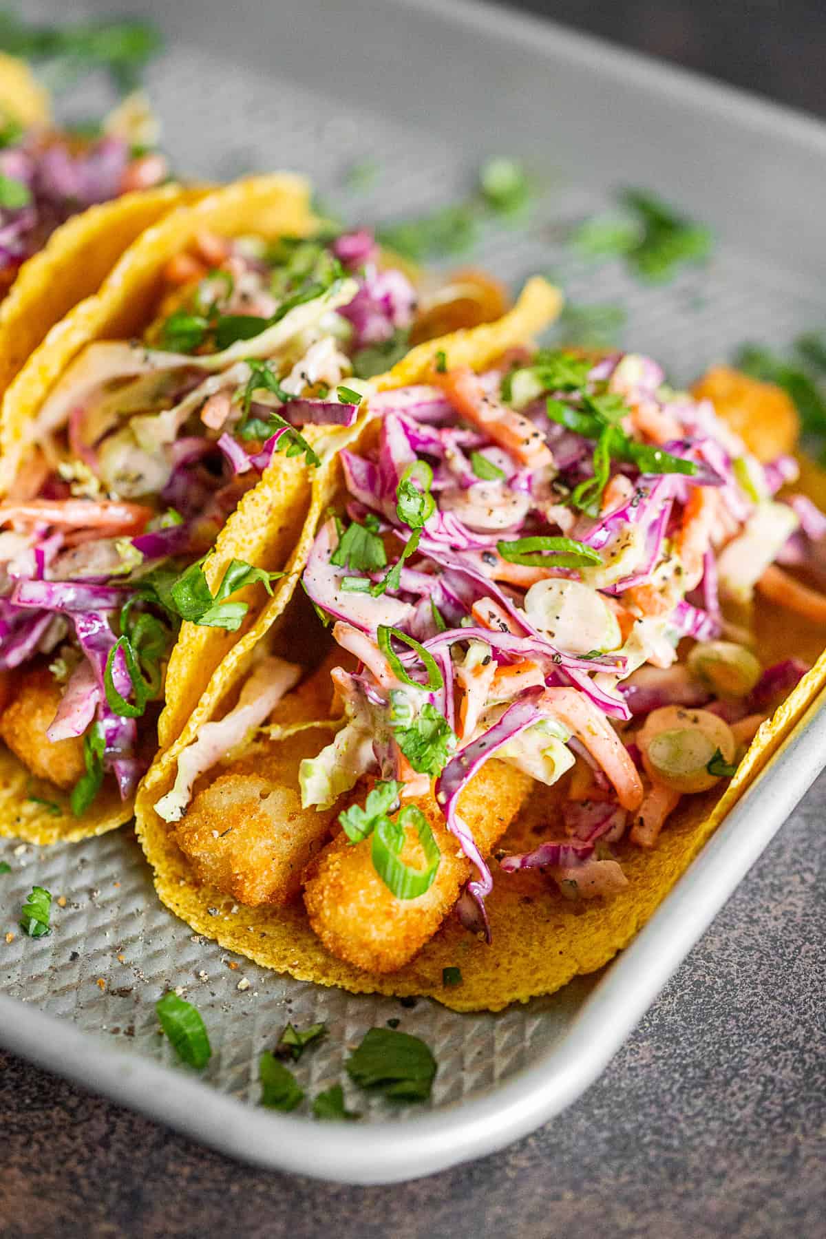 Easy Fish Tacos topped with slaw.