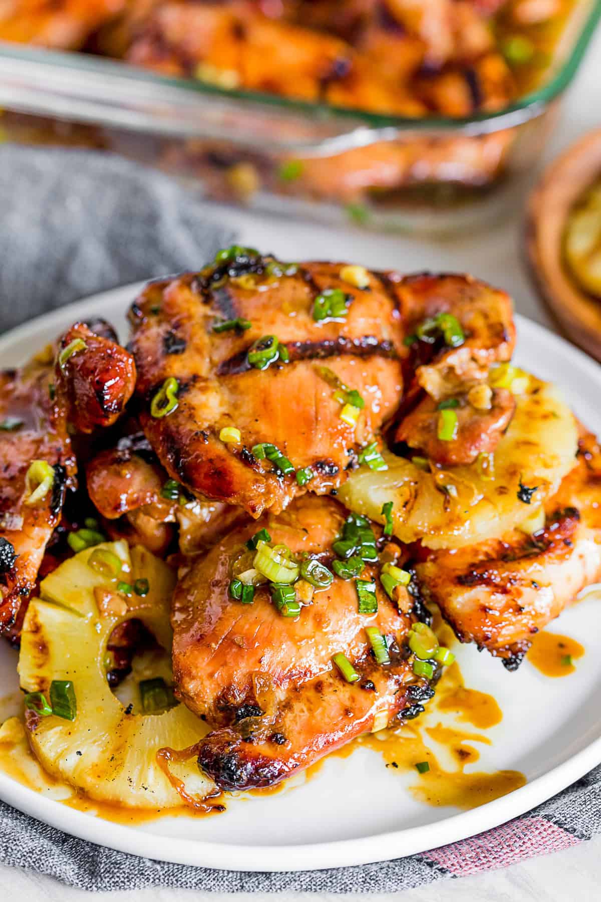 grilled sweet soy marinated chicken thighs on a serving platter. 