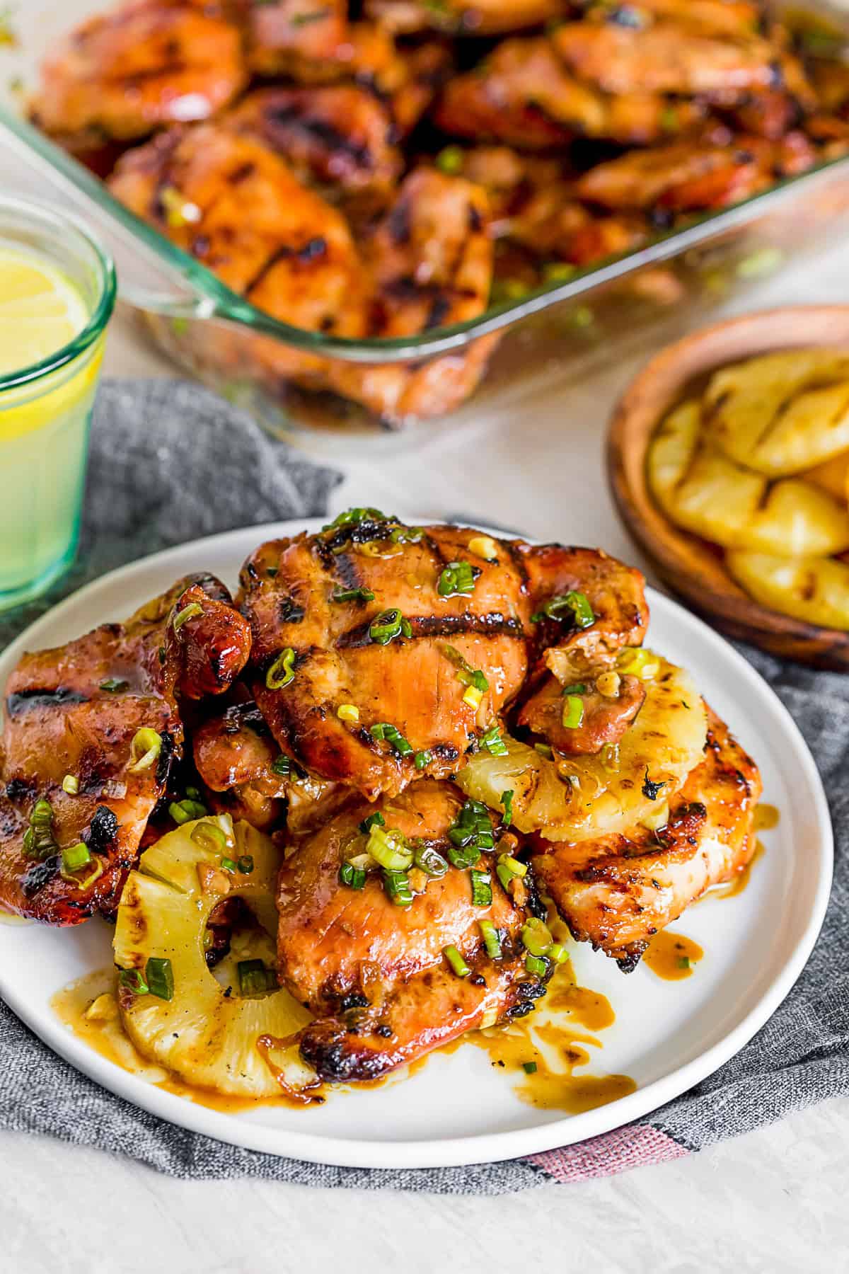grilled chicken thighs on a serving plate. 