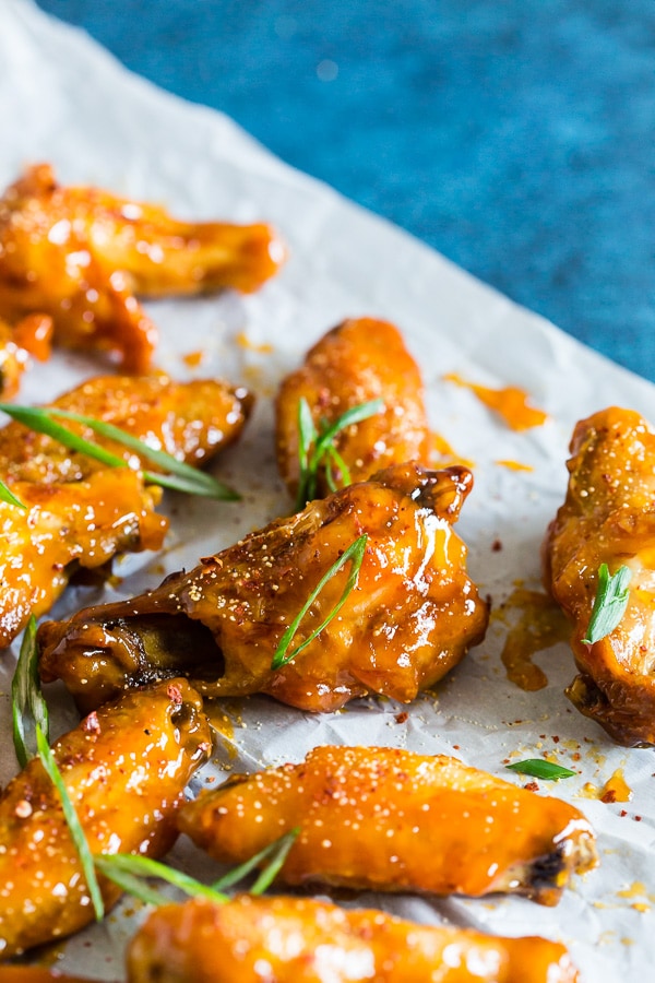 These pineapple mango habanero chicken wings are the perfect summertime appetizer or easy dinner! They're a delicious mix of sweet and spicy and can be made in your oven or the grill. It's time to give into your chicken wing cravings!
