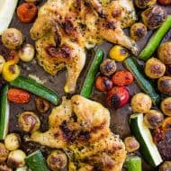 This sheet pan spatchcocked Cornish hens with summer vegetables is the perfect weeknight dinner. It all bakes up on one sheet pan and is packed with perfectly crisp Cornish hens, zucchini, baby potatoes and cherry tomatoes all tossed in an olive oil, oregano, thyme mixture. You'll love this sheet pan meal!