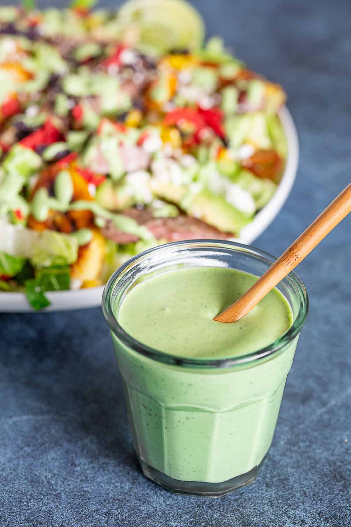 Cilantro dressing in a glass jar.