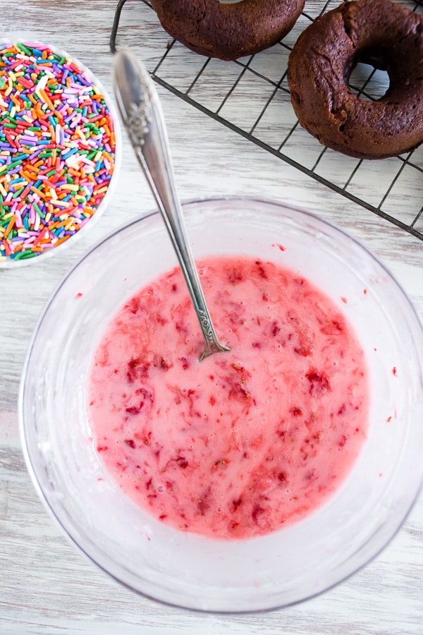 These baked chocolate donuts are studded with fresh strawberries, chocolate chips and topped with a homemade strawberry glaze. Trust me, if you love donuts you're going to go crazy over these chocolate strawberry baked donuts!