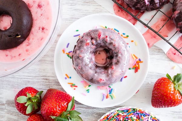 These baked chocolate donuts are studded with fresh strawberries, chocolate chips and topped with a homemade strawberry glaze. Trust me, if you love donuts you're going to go crazy over these chocolate strawberry baked donuts!