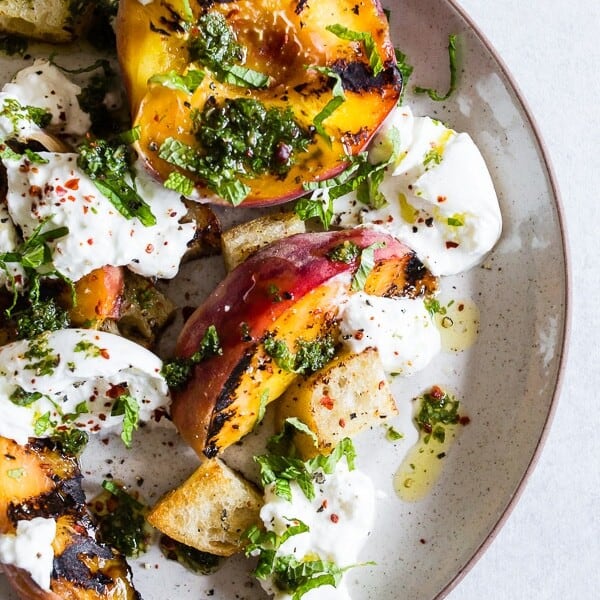grilled peach burrata salad on a plate