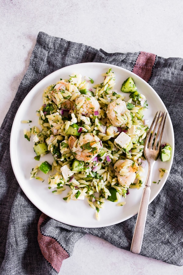Herbed Shrimp Orzo Salad on a plate with a fork.