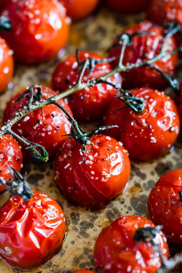 cooked on the vine roasted tomatoes in a metal baking dish.