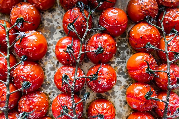 cooked on the vine roasted tomatoes in a pan.