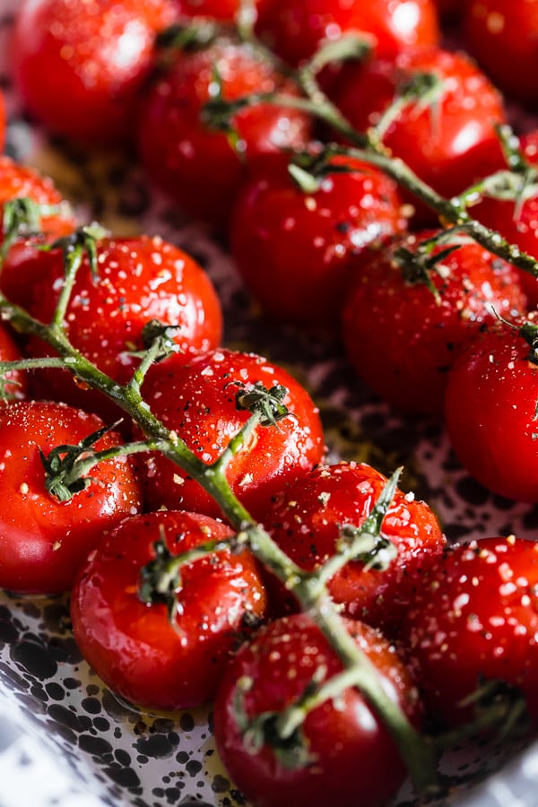 uncooked tomatoes on the vine.