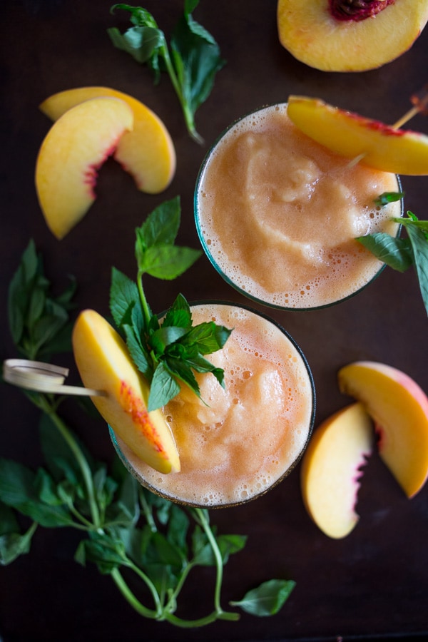These peach tea bourbon slushies are the perfect summer addition. Full of peach tea, bourbon and lots of fresh peaches. This cocktail is summer perfection!