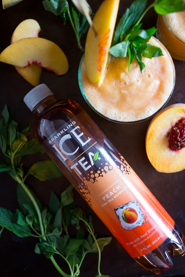 These peach tea bourbon slushies are the perfect summer addition. Full of peach tea, bourbon and lots of fresh peaches. This cocktail is summer perfection!