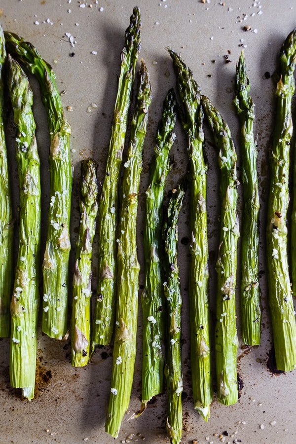 This roasted asparagus is perfectly seasoned and the perfect side dish. Made with just 4 ingredients and ready in just 15 minutes. You'll love how easy it is to go from boring asparagus to CRAZY GOOD asparagus. 