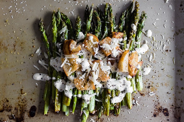 Roasted Asparagus Caesar Salad topped with greek yogurt caesar dressing. 