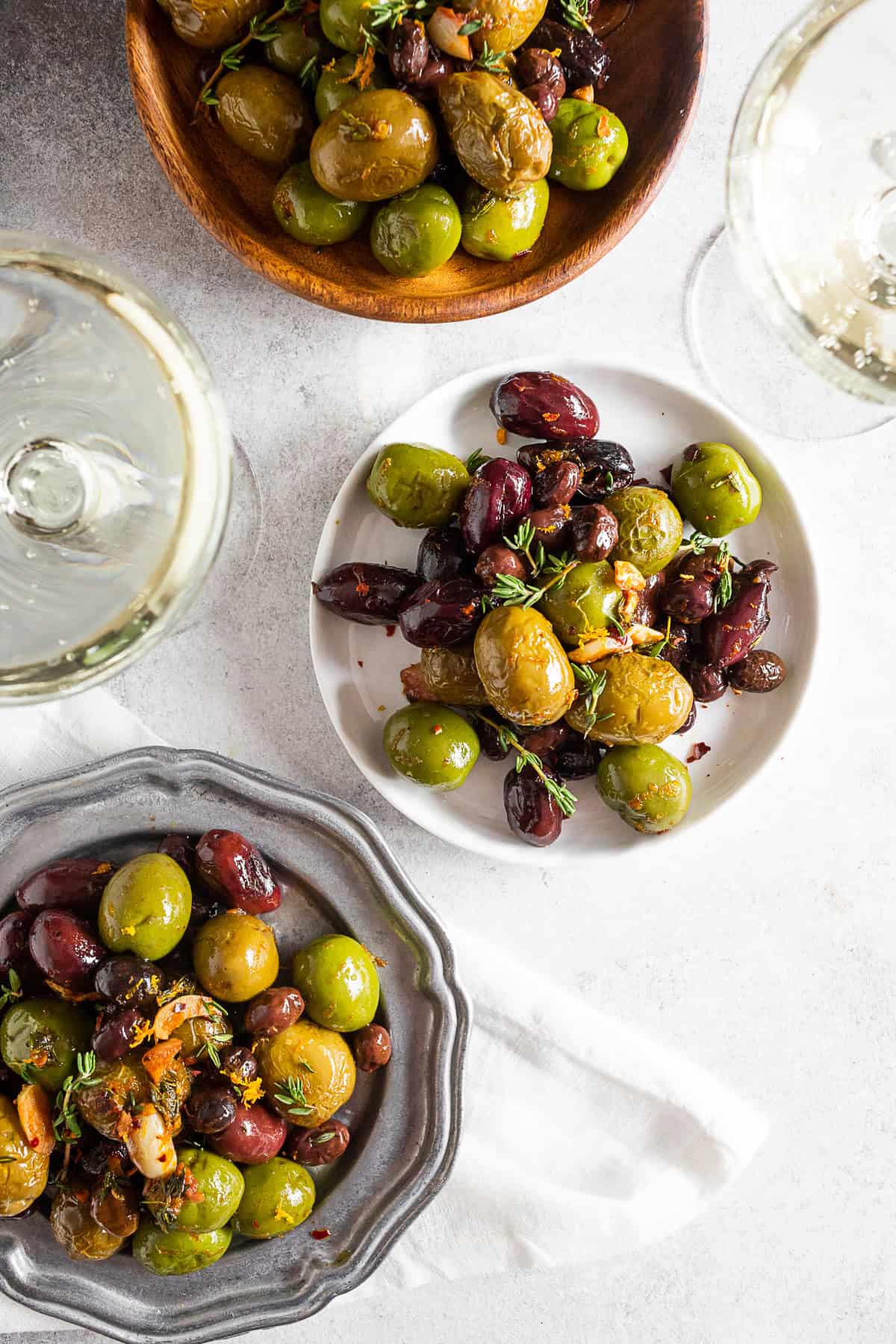Garlic Herb Roasted Olives served with prosecco. 