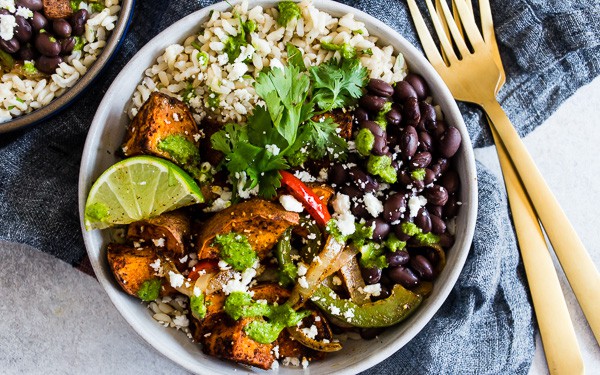 Sweet Potato Black Bean Burrito Bowls served in a bowl with a fork.