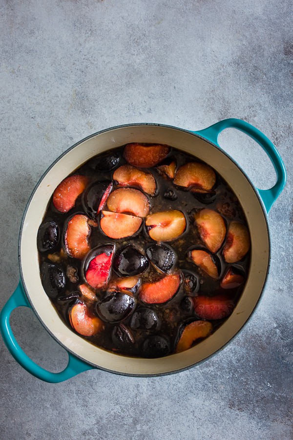 Black plums in a pot. 