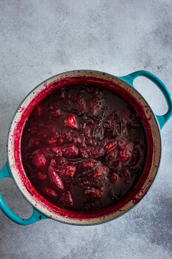 Half cooked plumbs in a pot. 
