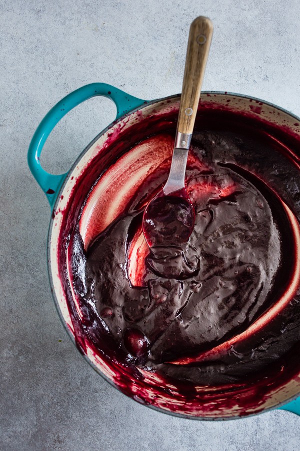 Vanilla Bean Plum Butter in a round cooking dish. 