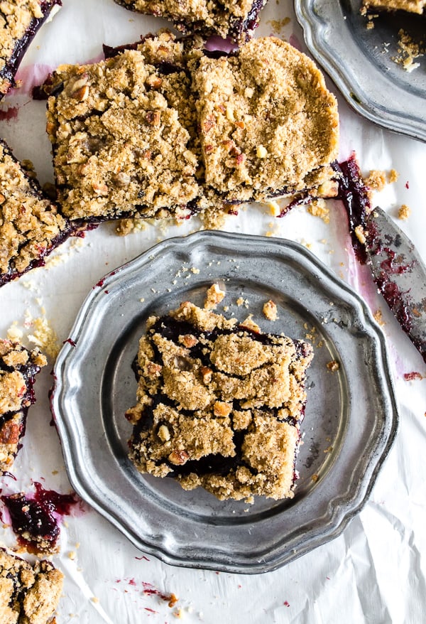 A Vanilla Bean Plum Butter Crumble Bar on a plate. 