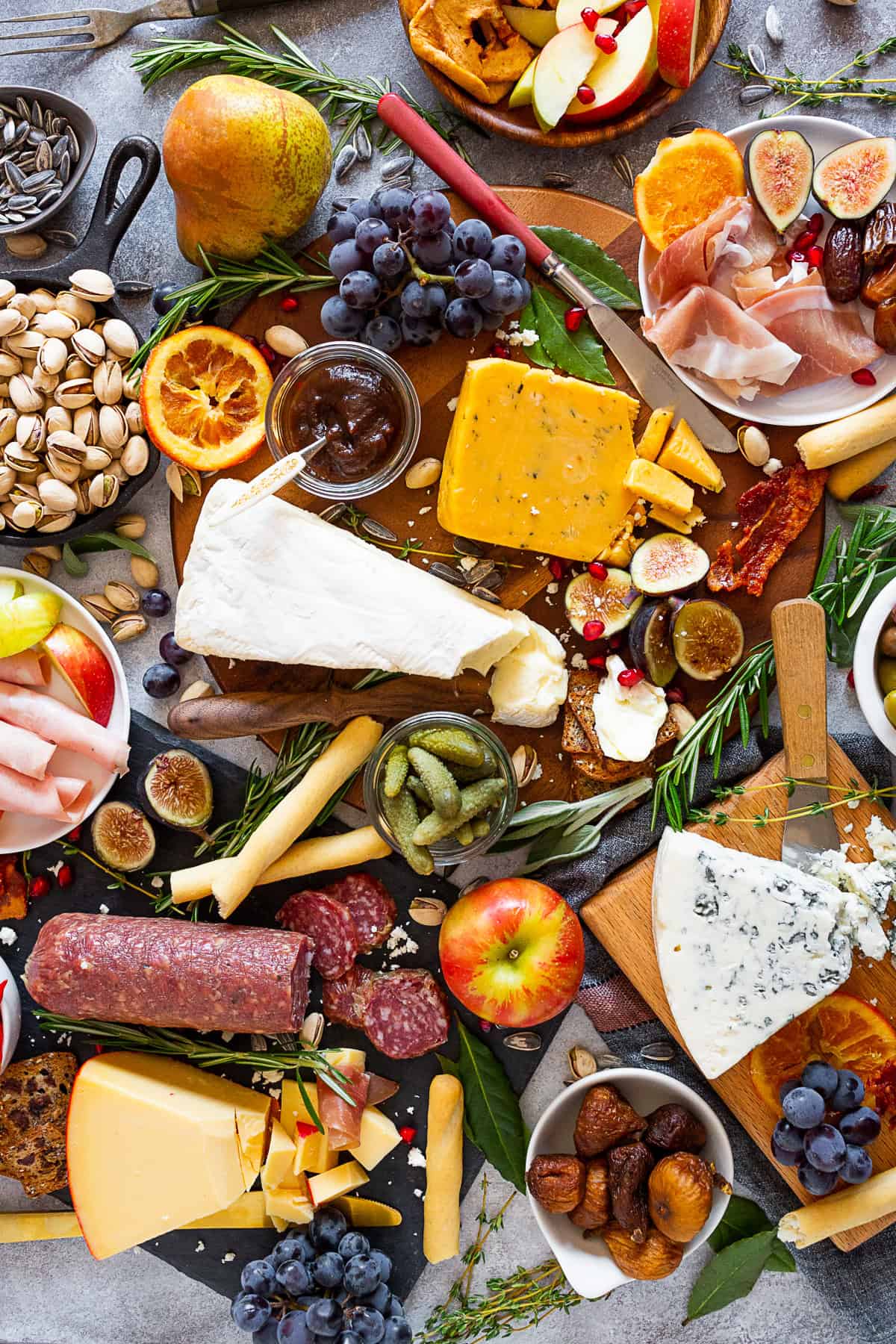 Fall Cheese Board decorated with fresh herbs. 