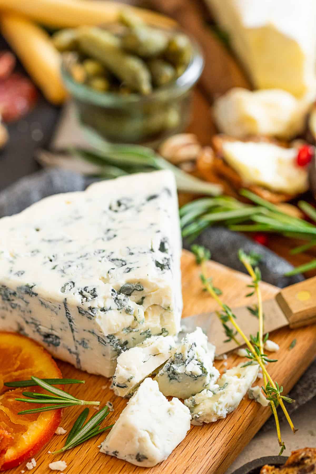 Fall Cheese Board shot of a wedge of gorgonzola cheese. 