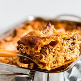 This Italian sausage and mushroom lasagna is PACKED with spicy Italian sausage, sliced baby bella mushrooms, baby spinach, lots of cheese and rich tomato sauce. It's super easy to throw together and bakes up like a dream. 