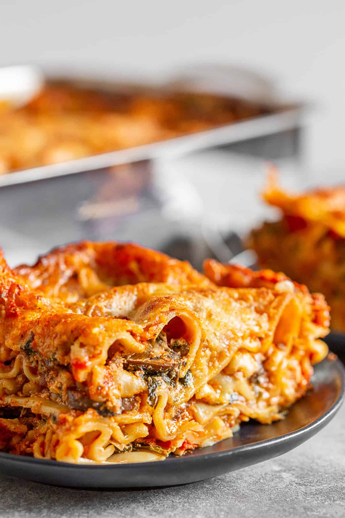 Italian Sausage Lasagna sliced on a plate. 