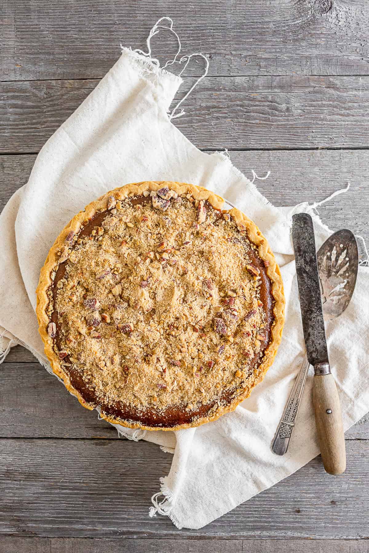 Streusel Topped Apple Butter Pumpkin Pie on a table.