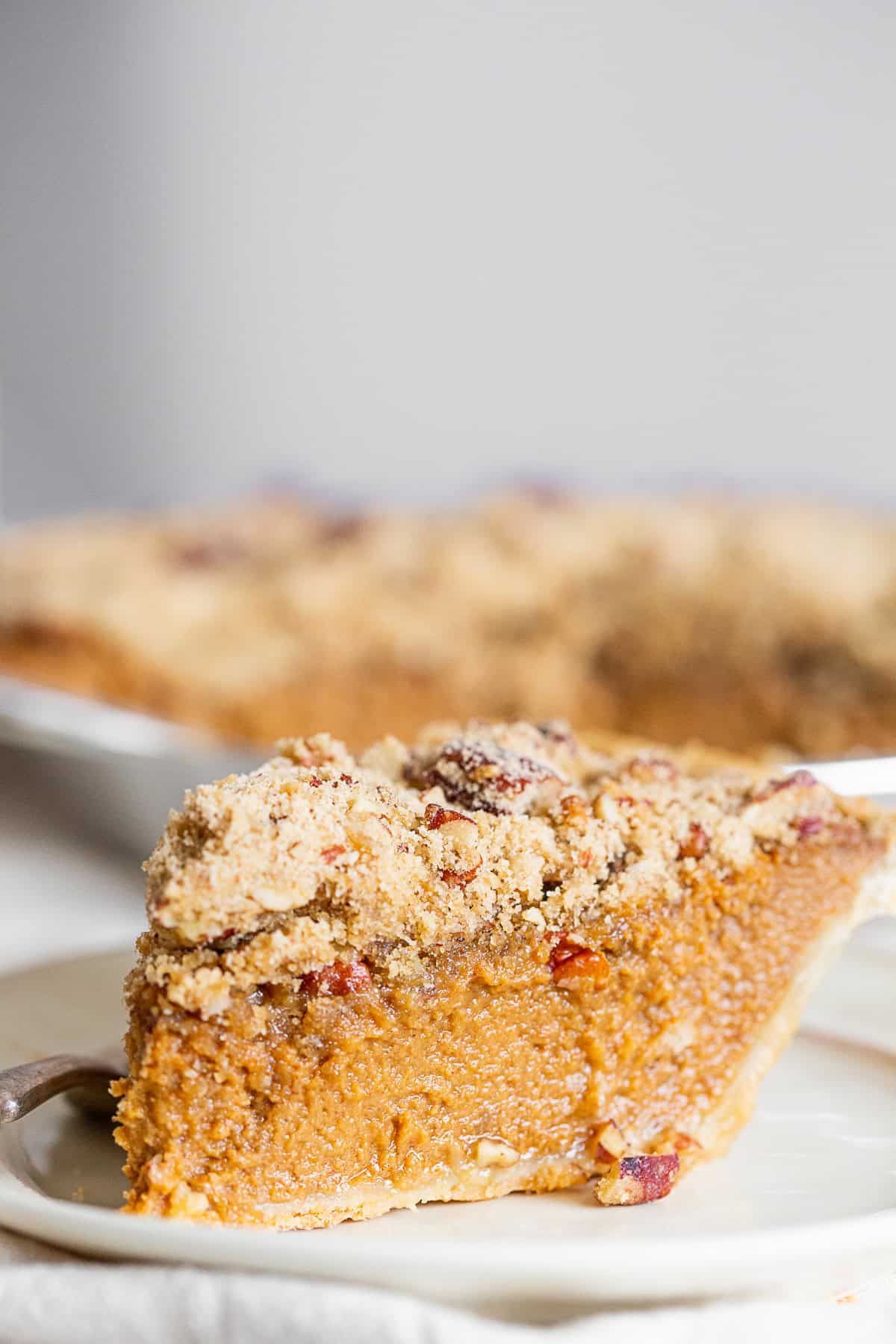 Streusel Topped Apple Butter Pumpkin Pie on a table.