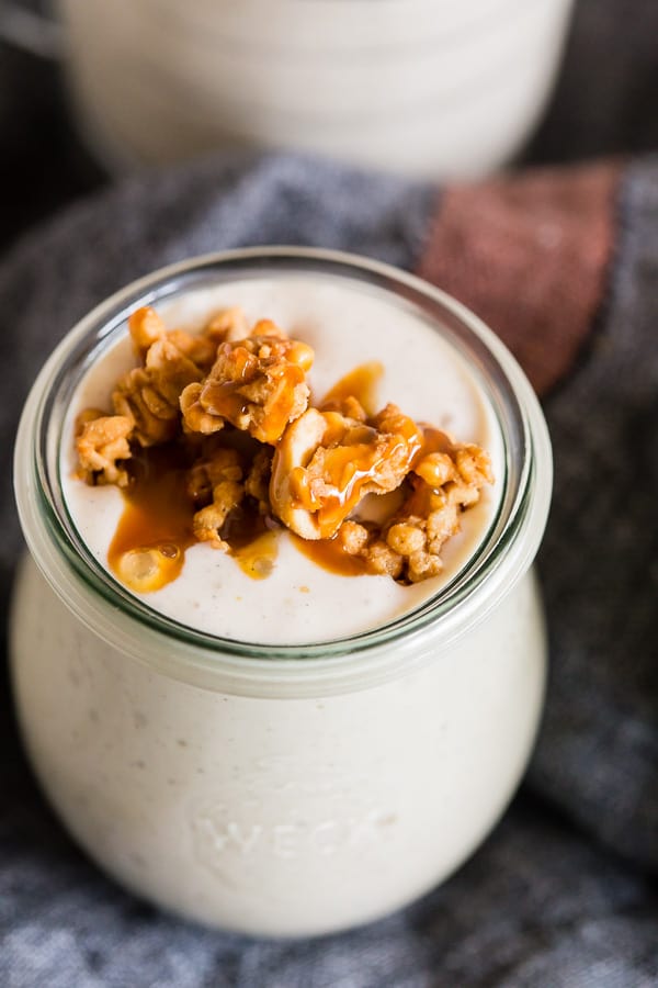 Caramel Apple Crisp Milkshake with granola and caramel sauce on top. 