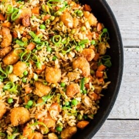 This crispy shrimp fried rice is the perfect busy weeknight meal. Crispy baked shrimp mixed together with a homemade vegetable and egg filled fried rice. Plus it's ready in just 20 minutes! How easy is that?