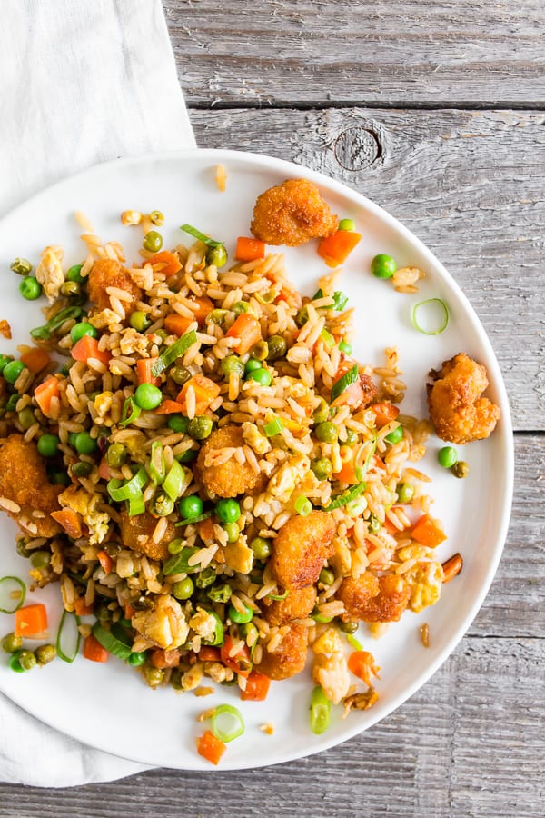 This crispy shrimp fried rice is the perfect busy weeknight meal. Crispy baked shrimp mixed together with a homemade vegetable and egg filled fried rice. Plus it's ready in just 20 minutes! How easy is that?