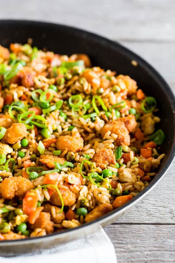 This crispy shrimp fried rice is the perfect busy weeknight meal. Crispy baked shrimp mixed together with a homemade vegetable and egg filled fried rice. Plus it's ready in just 20 minutes! How easy is that?