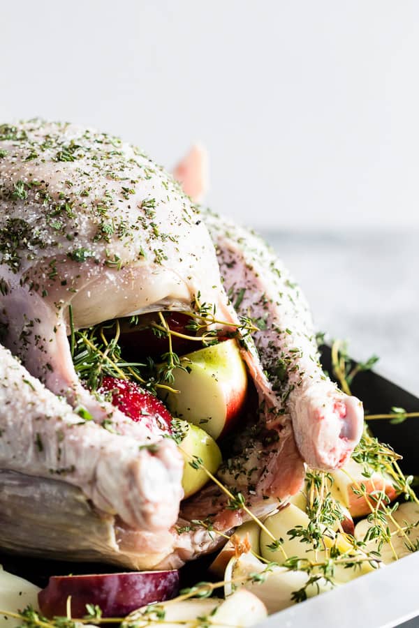 An uncooked Garlic Herb Maple Roast Turkey. 