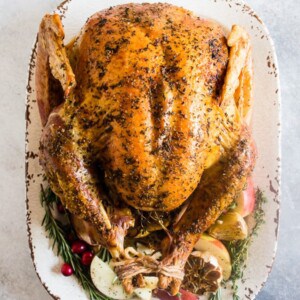 This garlic herb maple roast turkey is packed full of flavor with just a touch of maple syrup sweetness. It’s the perfect addition to any holiday table!
