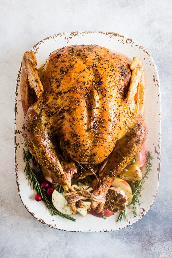 Garlic Herb Maple Roast Turkey on a serving tray. 
