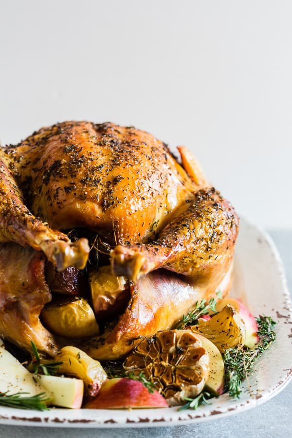 Garlic Herb Maple Roast Turkey on a plate stuffed with fillings. 