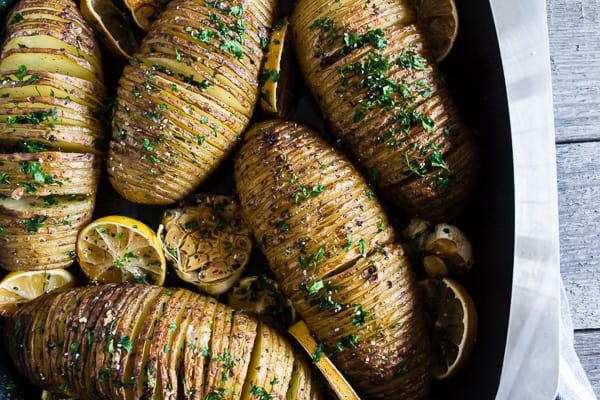 These lemon herb Hasselback potatoes are a great twist to a typical roast potato. Packed full of lemon and garlic flavor they make a fun addition to any dinner table. 