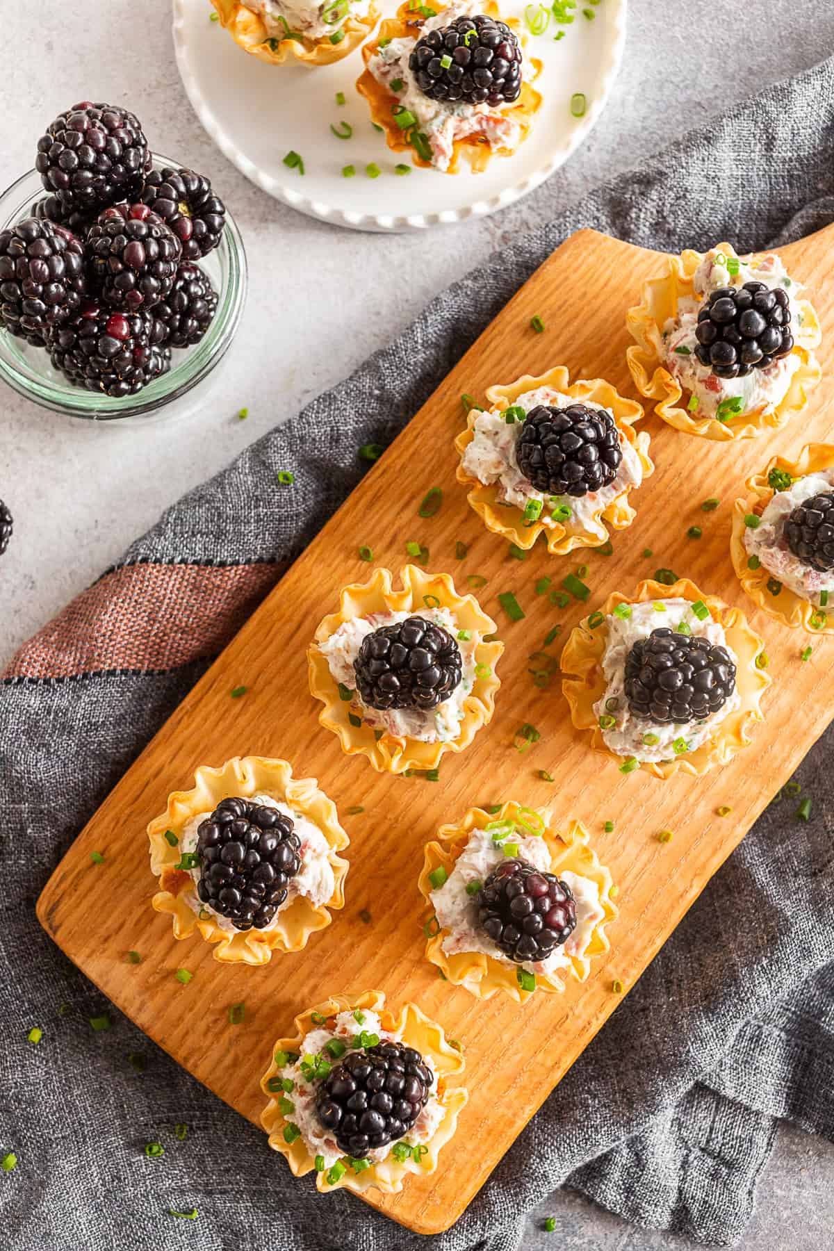 Goat Cheese Prosciutto Phyllo Bites on a serving board.