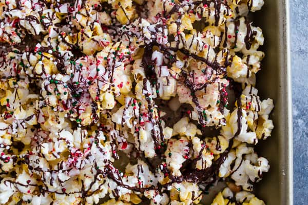 Peppermint Bark Popcorn covered in sprinkles.