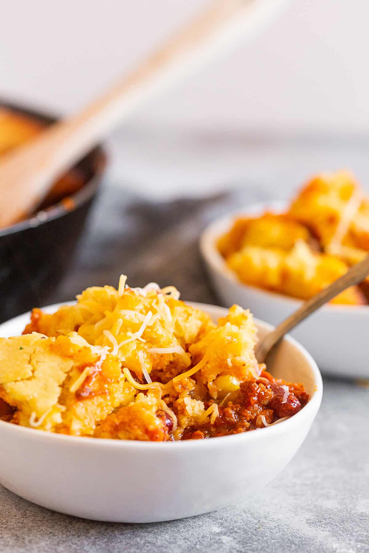 Buttermilk Cornbread Topped Chili spooned into a bowl.