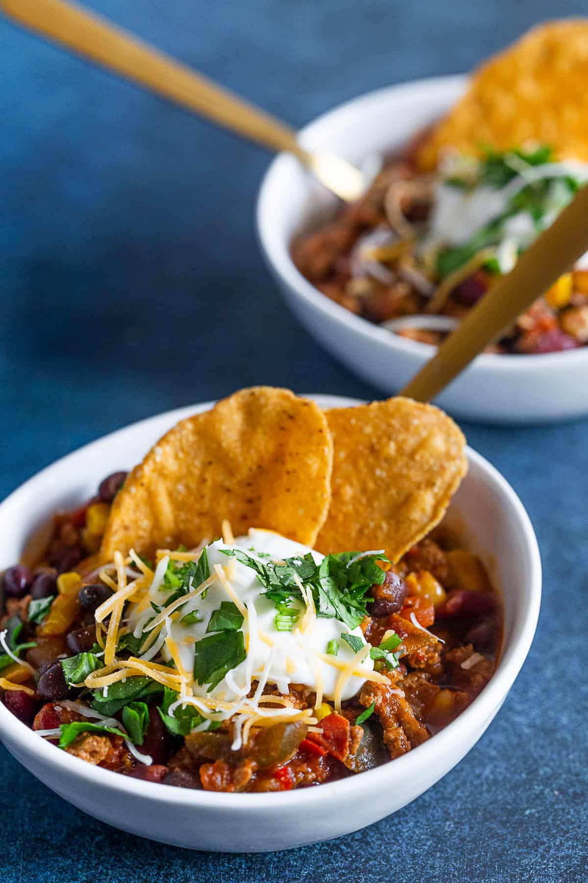 Chipotle Ground Turkey Chili in 2 small white bowls. 