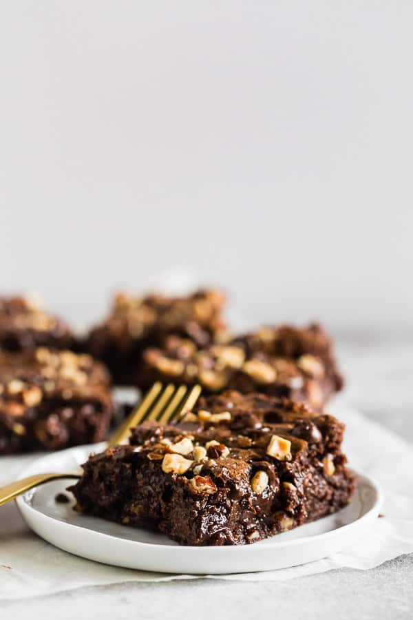 Hazelnut Buckwheat Brownies on serving plates. 